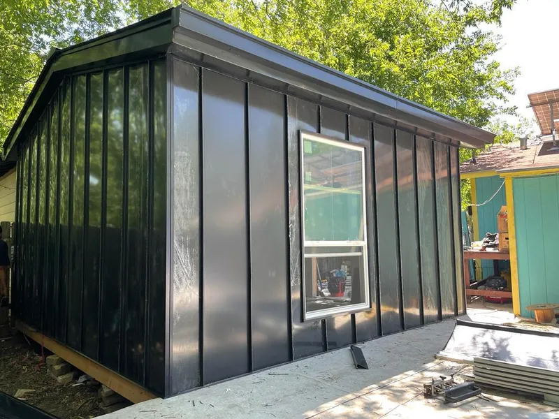 Black standing seam metal wall panels for Roof Inspection in Bull Mountain